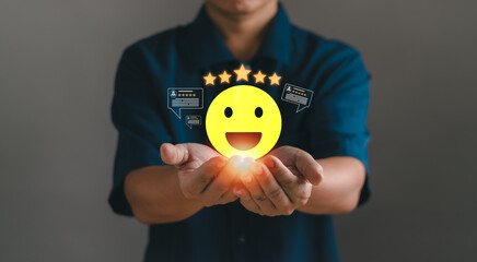 Concept of customer experience, satisfaction survey, excellent service ranking, customer hand showing happy face icon, giving review rating for best product and service