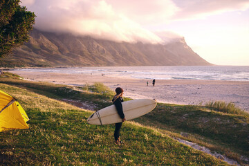 Camping, surfboard and woman at sea for travel, thinking or girl with view in nature to exercise on...