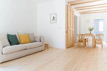 Fototapeta premium Stylish living room with cozy couch and elegant table for modern home decor inspiration