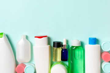 Top view of cosmetics bottles on colored background. Skin care concept with space for your design