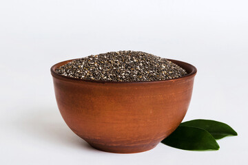 Chia seeds in bowl on colored background. Healthy Salvia hispanica in small bowl. Healthy superfood
