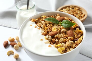 Delicious granola with yogurt on the table