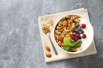 Delicious granola with berries and yogurt on the table