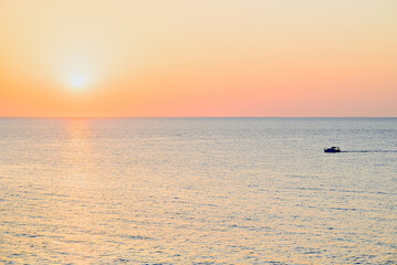 Obraz premium Beautiful sunset with orange sky on the beach of Menorca, Balearic Islands. Sunset, nature