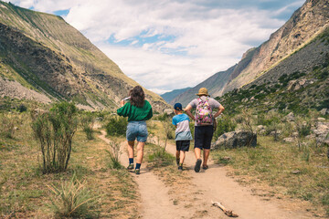 family walking in the mountains