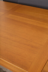 Teak Draw Leaf Table. Warm tone teak wood. Mid-century modern design. Interior product photograph.