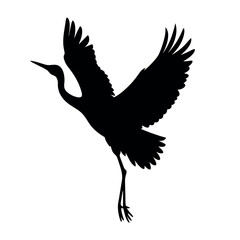 Obraz premium a black silhouette of a crane in flight isolated white background