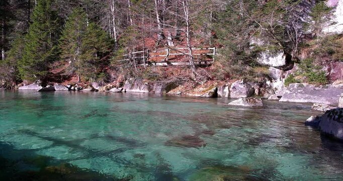 Fantastic autumn landscape on the Dolomite lakes of Amola