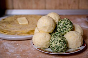 Traditional сaucasian tortillas with filling (khychiny) with mashed potatoes, cottage cheese and herbs