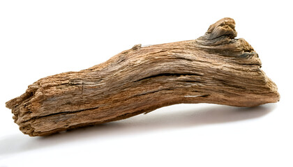 Obraz premium A single piece of natural driftwood isolated on a white background. Perfect for home decor or art projects. The weathered texture adds a rustic and organic touch