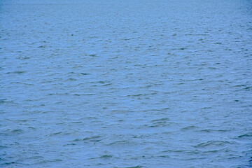  Deep blue rippling water surface. 