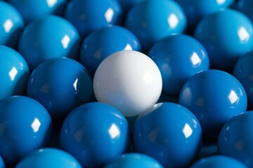 One white ball highlighted among blue, depicting leadership or top talent, sleek background