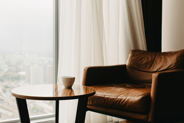 A chair and a cup on the table.
