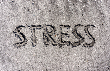Fototapeta premium lifestyle and stress concept. Concept word Stress written on beautiful ocean sand beach. Beautiful ocean sand beach background, copy space. Medical and psychology stress concept.