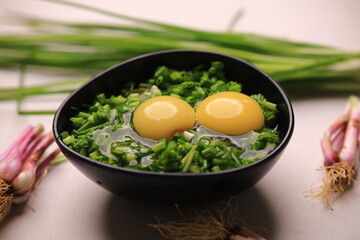 bowl of egg yolks isolated on white background, top view with green vegetables.close up image of two eggs yolk in a bowl are one of the food ingredients on the restaurant table in the kitchen .