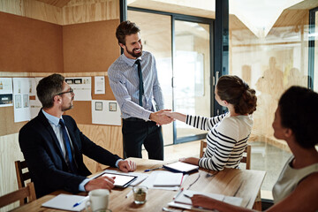 Planning, collaboration and business people with handshake, partnership and project brainstorming...