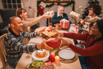 Celebrate Christmas at Home, Happy Family Dinner with Father, Mother, Children Gathered, Enjoying Festive Food Table Together, Smiling Embracing Joy of Holiday Season in a Warm Indoor Setting