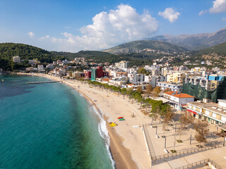 Aerial drone photo of boulevard and beach in the coastal town of Himare in Albania.