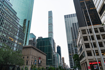 Fototapeta premium New York City, USA - July 09, 2023: Skyscraper building architecture. Skyscraper business district. Modern building. Business building skyscraper in city. City downtown with skyscraper. Architecture