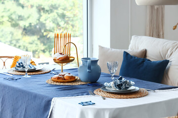 Table setting for Hannukah in dining room