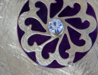 crystal stone and flower motif jewelry detail