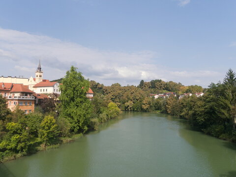 Novo Mesto Town,  Slovenia.  View from the Kandijski bridge over the tranquil  river Kyrka.  Beautiful historic old city seen from the cast iron crossing.