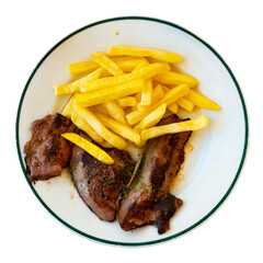 Pieces of fried lamb liver, cooked with garlic and parsley, are laid out on plate. Dish is served with side dish - portion of French fries. Isolated over white background