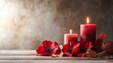 Red candles and red poppies create a serene atmosphere for Remembrance Day tribute