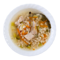 Appetizing traditional Russian thick sour soup rassolnik served with piece of boiled beef in plate. Isolated over white background