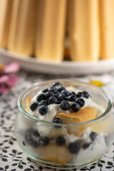 Delicious summer dessert with whipped and sour cream covered with baked sponges, tasty cold cake for hot summer days