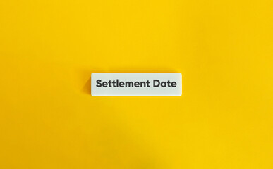 Settlement Date. Text on Block Letter Tile on Yellow Background. Minimal Aesthetic.