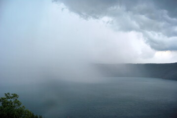 rain at the lake in the mountains