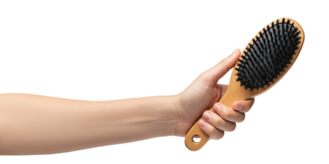 Hand holding a hair brush, brushing, isolated transparent png