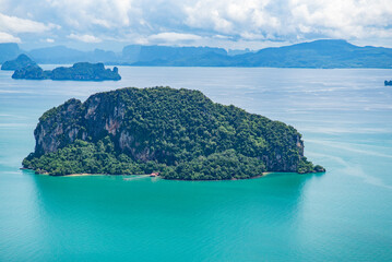 aerial landscape view of breathtaking natural beauty of coastline and nature of "Ko Lokalat" Island aka Ko Rang Nok,  located in Phang Nga Bay as part of Andaman Sea near Krabi Island in Thailand 