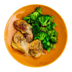 Delicious fried chicken served with broccoli on platter. Isolated over white background