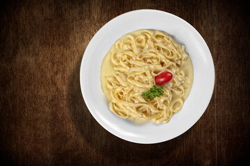 Fettuccine with Alfredo sauce seen from above on the plate