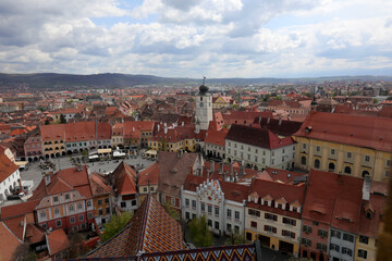 Obraz premium View of Sibiu city, city center of Sibiu in a sunny day. The image are taken from the tower of the Evangelical Cathedral.