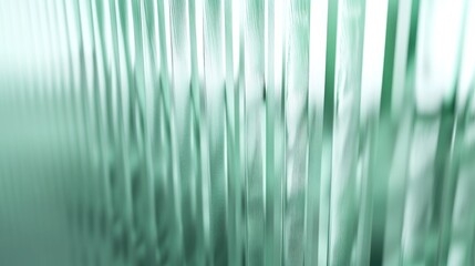 A blurred image of a green curtain with texture and folds