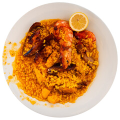 Traditional Spanish paella with shrimp, meat, chicken and various seafood. Isolated over white background