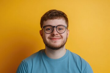 Obraz premium A person wearing glasses and a blue shirt, suitable for use in office or business settings