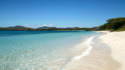 A pristine white sand beach with crystal clear turquoise waters.