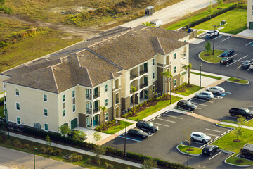 Aerial view of american apartment buildings in Florida residential area. New family condos as...