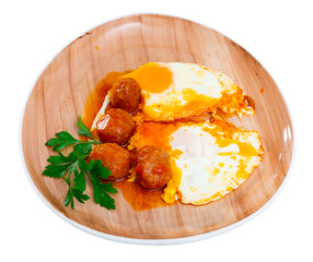 Delicious smoked Spanish albondigas, meatballs cooked with scrambled eggs. Isolated over white background