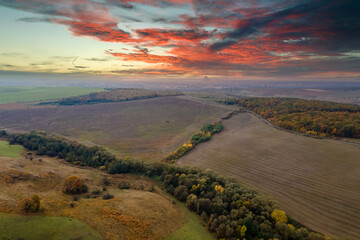 Aerial view of plowed agricultural fields with cultivated fertile soil prepared for planting crops...