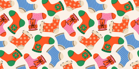 Festive seamless pattern with Christmas socks with xmas ornaments. Noel socks with snowflakes, bows. Red, blue, pink, green. Stockings for holiday projects, gift wrap, textiles, and seasonal backgrop.