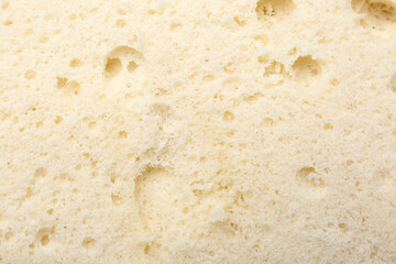 Tasty sponge cake as background, top view