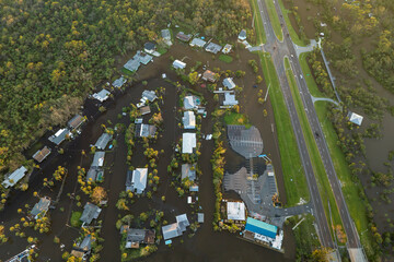 Aftermath of natural disaster. Surrounded by hurricane Ian rainfall flood waters homes in Florida...
