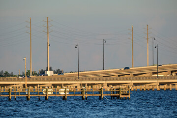 Barron Collier Bridge and Gilchrist Bridge in Florida with moving traffic. Transportation...