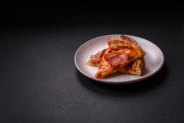 Pepperoni pizza with sausage, mozzarella cheese, tomatoes, salt and spices