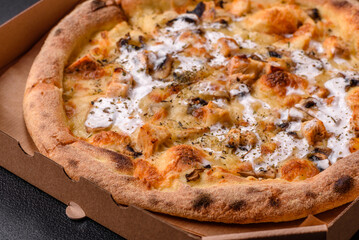 Creamy pizza with truffle cheese, mozzarella, chicken and mushrooms